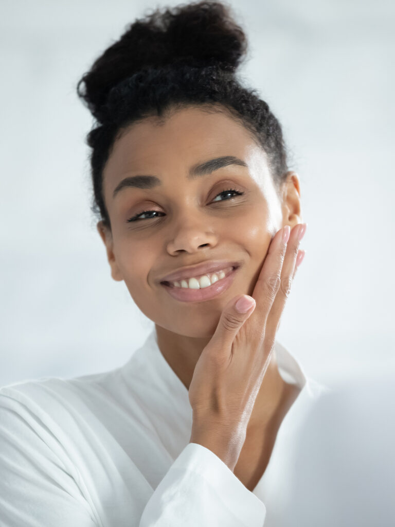 Woman with her hand on her cheek